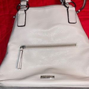JESSICA SIMPSON tan leather purse, 2 outside zip pockets, vg condition $15
